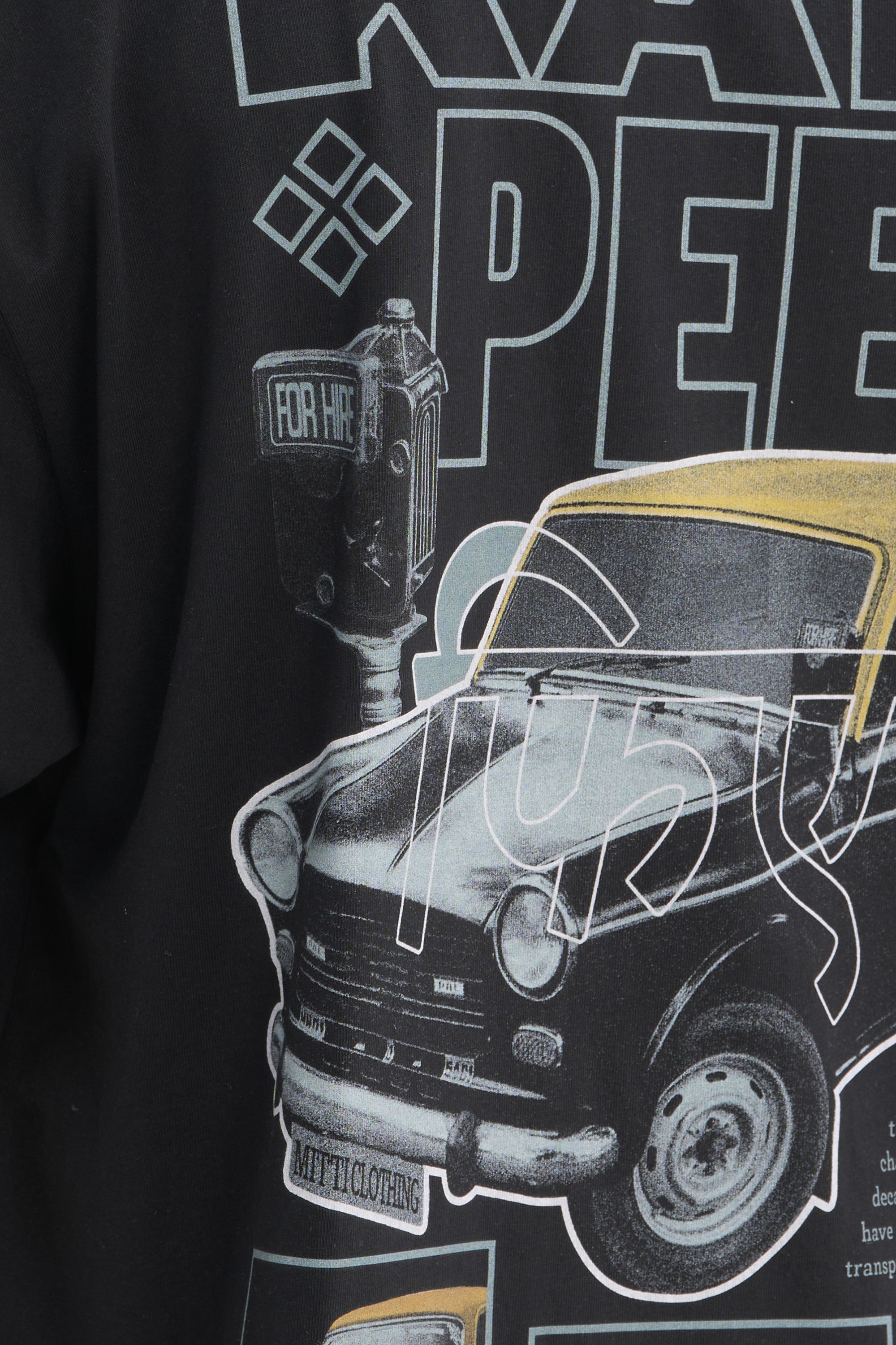 Mitti Kali Peeli Graphic Tee on model from behind, street style shot